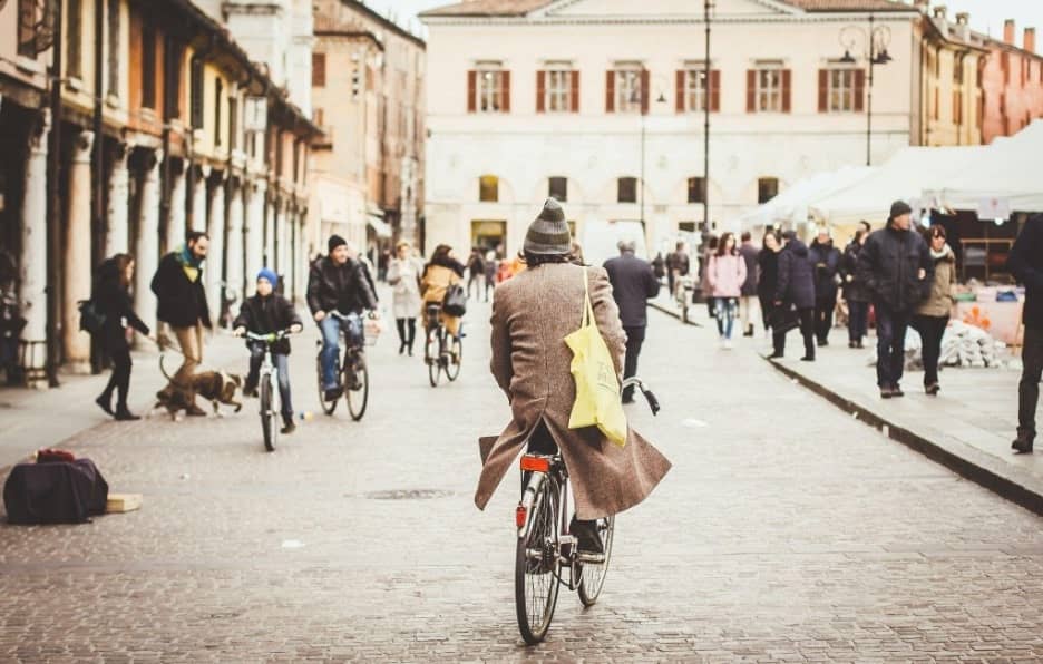 lifestyle image of a man riding a bicycle